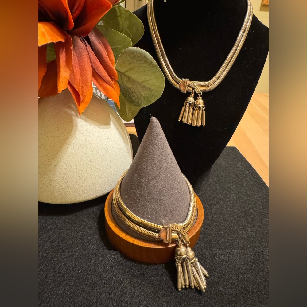 Vintage pair of gold tone snake double tassel pendant necklace and bracelet set